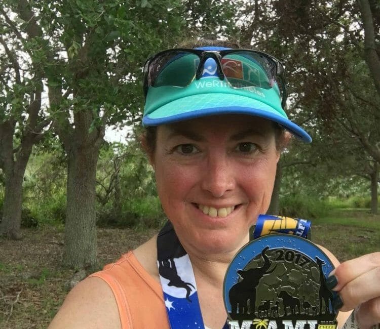 Hilary Topper with her medal from Miami Man Triathlon
