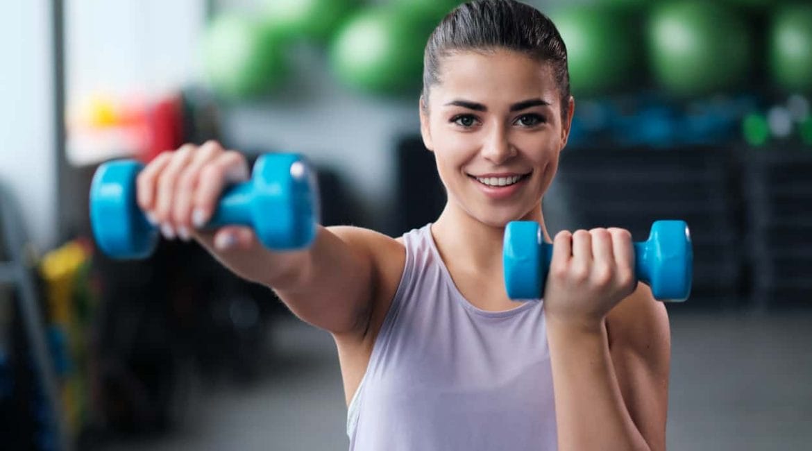 woman Strength training with dumbbells