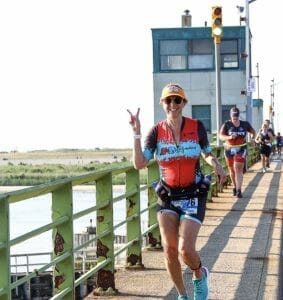 Hilary running over the bridge