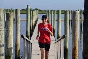 Hilary running on the pier 