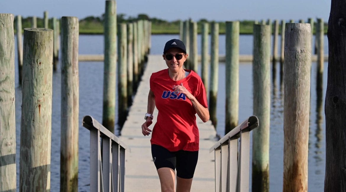 Hilary running on the pier